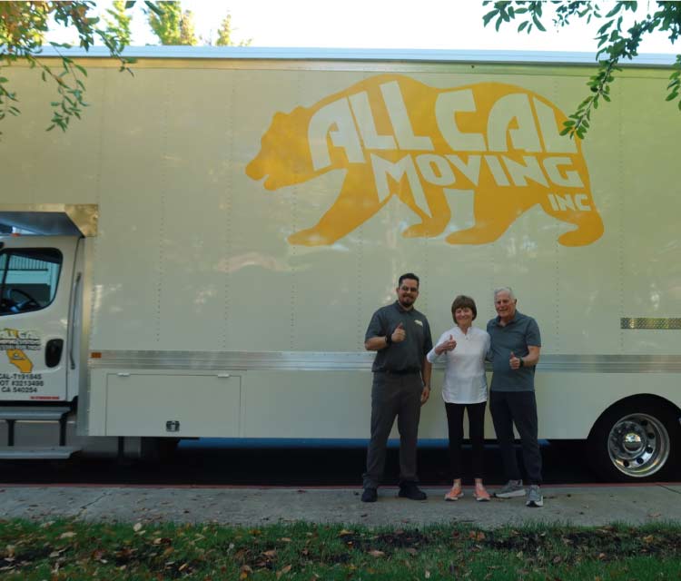 roert torres and seniors with the truck of all cal moving behind, happy for the moving service 