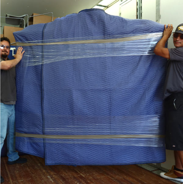 movers moving a piano in visalia, ca